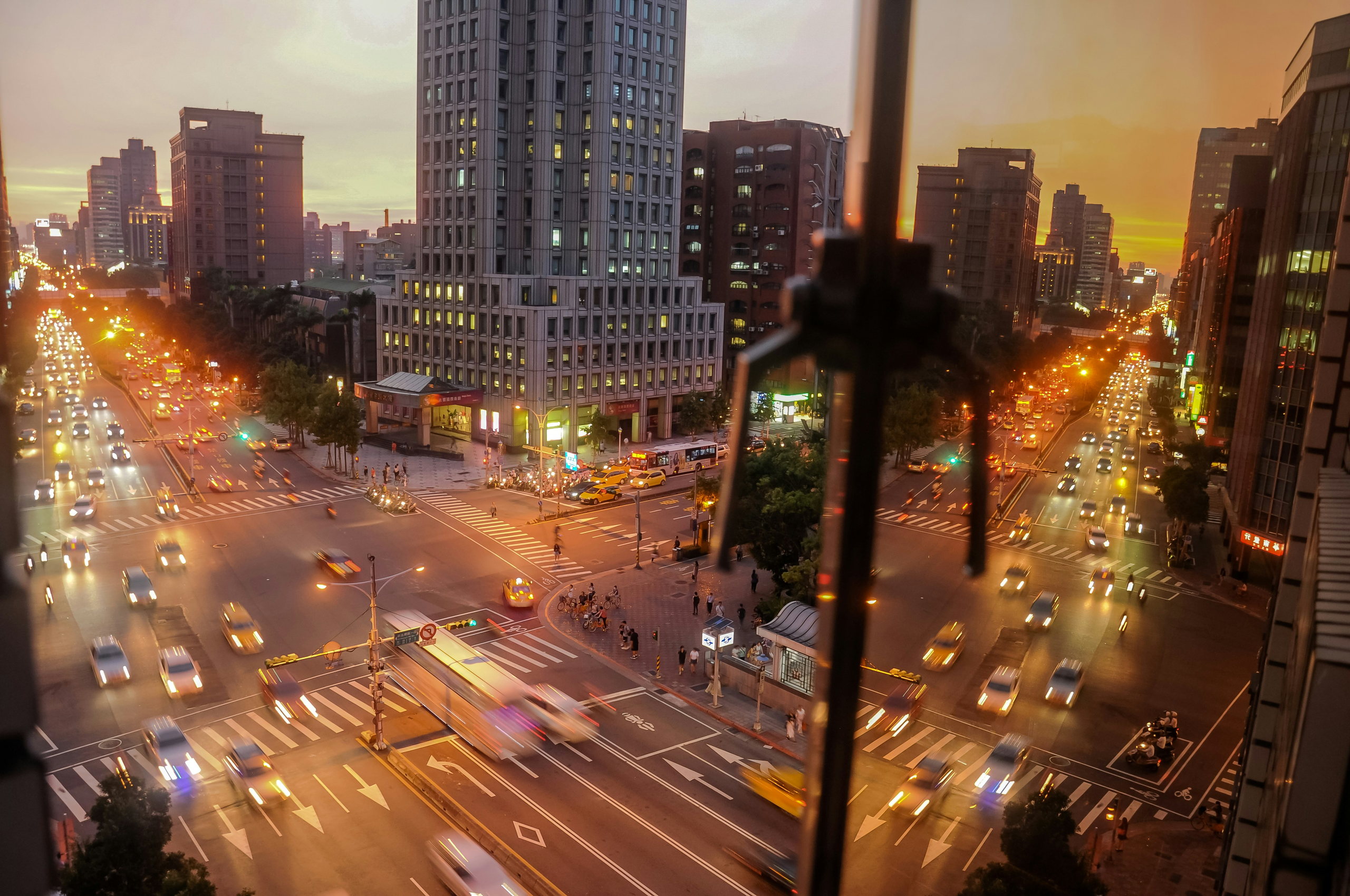Taipei city traffic and office buildings at dusk